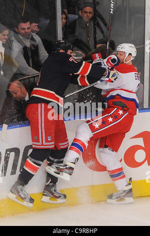 Washington Capitals defenseman John Erskine, right, fights for the puck ...