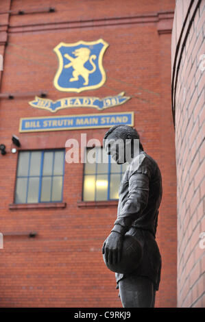 The statue of John Greig, the 'Greatest Ever Ranger' outside Ibrox stadium, home of Rangers Football Club.Glasgow Rangers tax bill could reach over £75million and the club is has now entered administration. Stock Photo