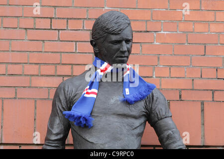 Ibrox Stadium, Edmiston Drive, Ibrox, Glasgow, Scotland, UK, Tuesday, 14th February, 2012. Statue of ex-player and manager John Greig, wearing a Rangers scarf, part of the memorial to the disasters and tragedies at Ibrox Stadium, the home of Glasgow Rangers Football Club Stock Photo