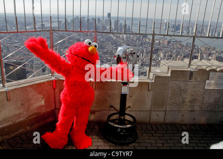 Elmo, Cookie Monster, Abby Cadabby and Grover from 'Sesame Street Live 1,2,3 imagine' visit The Empire State Building on February 21, 2012. Stock Photo