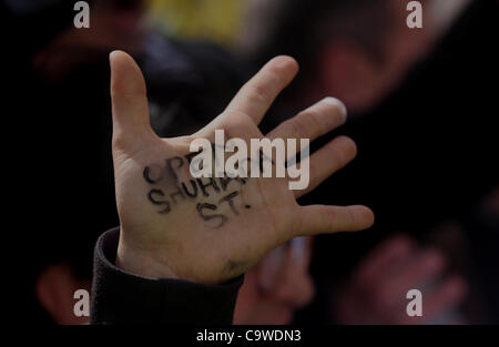 Feb. 25, 2012 - Hebron, West Bank, Palestinian Territory - A Palestinian protester holds a placard during a protest against the closure of Shuhada street to Palestinians, in the West Bank city of Hebron February 24, 2012. Some 200 protesters, including foreign and Israeli activists, gathered on Frid Stock Photo