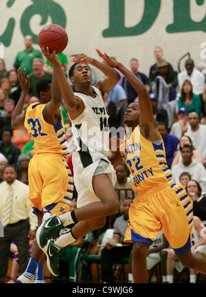 Feb. 25, 2012 - St. Petersburg - CHRIS ZUPPA   |   Times.SP 350568 ZUPP Baskeball 15.(St. Petersburg, 02/25/2012) St. Petersburg High School's Dayon Griffin (10) is fouled as he tries to get past Martin County's Traevis (cq)Graham (32) and Anthony Wilson (22). St. Petersburg High School plays Martin Stock Photo