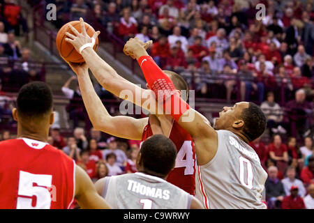 Feb. 26, 2012 - Columbus, Ohio, U.S - Ohio State Buckeyes forward Jared Sullinger (0) fouls Wisconsin Badgers forward/center Jared Berggren (40) over the top on a drive to the basket in the first half of the game between Wisconsin and Ohio State at Value City Arena, Columbus, Ohio. Wisconsin defeate Stock Photo