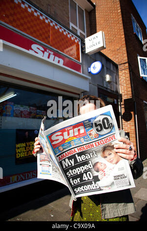 The Sun on Sunday newspaper first edition on sale at a newsagents in London, UK. The newspaper is seen as the replacement for the NOTW, from Murdoch's News International / Newscorp. It is reported that 3million copies sold on the first day. Stock Photo