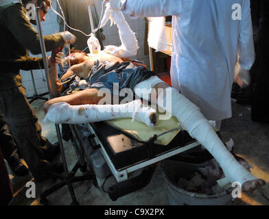 An injured man, who was injured in explosion in Nowshera, being treated at Lady Reading hospital (LRH) in Peshawar on Monday, February 27, 2012. Atleast five people were killed and fifteen people were injured in remote-controlled bomb  explosion after Awami National Party Stock Photo