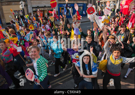 1st March 2012, Cardiff, UK. Welsh patriotic children enjoy celebrating in Saint David’s Day St Mary's Street. Stock Photo