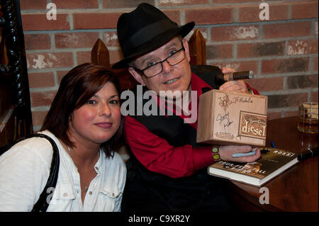 March 2, 2012 - Bethlehem, PA, U.S - Author and reality show star, SHORTY ROSSI, of the hit TV show, ''Pit Boss'', presents super fan, MICHELLE GUAY, with a signed box of his Diesel cigars at his book signing and cigar promotion event held at Cigars International in Bethlehem Pa. Rossi the owner and Stock Photo