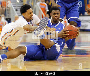 March 4, 2012 - Gainesville, KY, USA - UK's Terrence Jones and Florida's Mike Rosario scrambled for a loose ball as the the University of Kentucky played the University of Florida in the O'Connell Center in Gainesville, Fl.,  Sunday, March 04, 2012. This is first  half men's college basketball actio Stock Photo