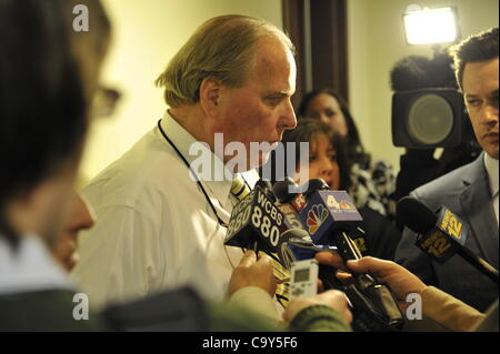 Nassau County Legislature, controlled by Republicans, votes along party lines to consolidate 8 police precincts into 4, on Monday, March 5, 2012, at Mineola, New York, Nassau County Legislature Presiding Officer & Majority Leader Peter Schmitt (center) told Press he did not expect backlash over vote Stock Photo