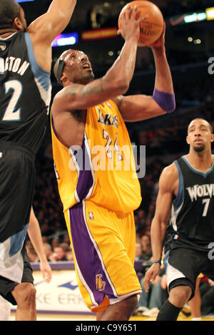 April 30, 2012 - Los Angeles, California, U.S - Lakers guard Kobe Bryant gets past Timberwolve  defenders reserve Wayne Ellington and guard Derrick  Williams to score as the Los Angeles Lakers defeat the  visiting Minnesota Timberwolves 104 - 85 at the Staples  Center in Los Angeles on Wednesday, Fe Stock Photo