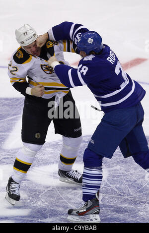 March 6, 2012 - Toronto, Ontario, Canada - Toronto Maple Leaf forward Jay Rosehill (38) lands a right above the left eye of Boston Bruins forward Shawn Thornton (22) during a fight in NHL action at the Air Canada Centre in Toronto, Ontario. Boston leads Toronto 5-3 after the 2nd period. (Credit Imag Stock Photo