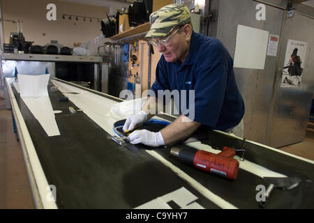 London Ontario, Canada - March 5, 2012. Alex Sigethy works on a template for a racing skull. Stock Photo