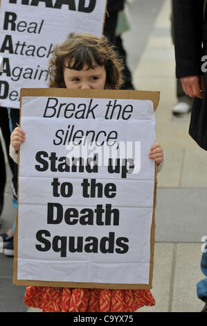 10 March 2012. Londonderry, Northern Ireland, UK - A girl holds a placard at a rally calling for a republican  vigilante group, Republican Action Against Drugs (RAAD) to disband following punishment shootings in the Bogside on  Wednesday, death threats and the killing of a father of two last month. Stock Photo