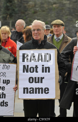10 March 2012 - Londonderry, Northern Ireland, UK. Protesters with placards at a rally calling for a republican vigilante  group, Republican Action Against Drugs (RAAD) to disband following punishment shootings in the Bogside on Wednesday,  death threats and the killing of a father of two last month Stock Photo