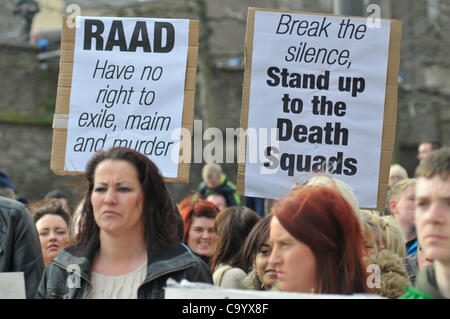 10 March 2012 - Londonderry, Northern Ireland, UK - Protesters with placards at a rally calling for a republican vigilante  group, Republican Action Against Drugs (RAAD) to disband following punishment shootings in the Bogside on Wednesday last,  death threats and the killing of a father of two last Stock Photo