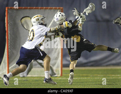 March 10, 2012 - Rock Island, Iowa, U.S. - Augustana's Mike McAleer hits Fontbonne's Sean Kulczyk as he takes a shot at the goal in the defensive area of the field Friday, March 9, 2012, during first-half action on Thorson-Lucken Field in Rock Island. (Credit Image: © John Schultz/Quad-City Times/ZU Stock Photo