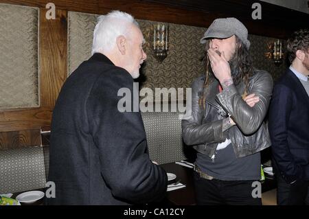 Malcolm McDowell, Rob Zombie at the induction ceremony for Star on the Hollywood Walk of Fame for Malcolm McDowell, Hollywood Boulevard, Los Angeles, CA March 16, 2012. Photo By: Michael Germana/Everett Collection Stock Photo