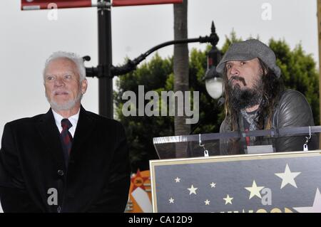 Malcolm McDowell, Rob Zombie at the induction ceremony for Star on the Hollywood Walk of Fame for Malcolm McDowell, Hollywood Boulevard, Los Angeles, CA March 16, 2012. Photo By: Michael Germana/Everett Collection Stock Photo