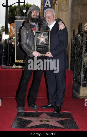 Rob Zombie, Malcolm McDowell at the induction ceremony for Star on the Hollywood Walk of Fame for Malcolm McDowell, Hollywood Boulevard, Los Angeles, CA March 16, 2012. Photo By: Michael Germana/Everett Collection Stock Photo