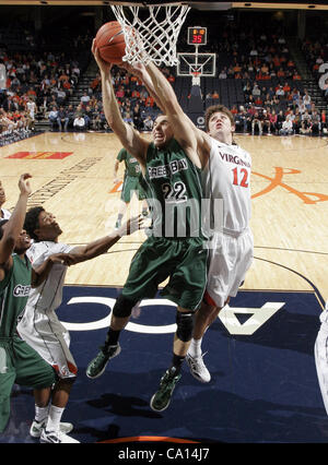 Nov. 25, 2011 - Charlottesville, Virginia, United States - Daniel Turner #22 of the Green Bay Phoenix fights for the loose ball with Joe Harris #12 of the Virginia Cavaliers during the game on November 26, 2011 at the John Paul Jones Arena in Charlottesville, Virginia. Virginia defeated Green Bay 68 Stock Photo