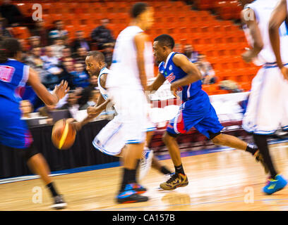 HALIFAX, NS - March 16, 2012: Halifax Rainmen guard Chris Hagan (left) dribbles the ball en route to a Rainmen victory over the Quebec Kebs 106-95 in the decisive third game of their best-of-three National Basketball League of Canada semi-final playoff series at the Halifax Metro Centre. With the vi Stock Photo