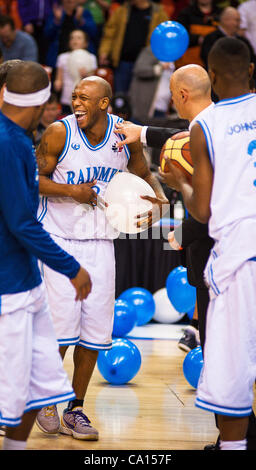 HALIFAX, NS - March 16, 2012: Taliek Brown (centre) and the Halifax Rainmen celebrate after defeating the Quebec Kebs 106-95 in the decisive third game of their best-of-three National Basketball League of Canada semi-final playoff series at the Halifax Metro Centre. With the victory, the Rainmen adv Stock Photo