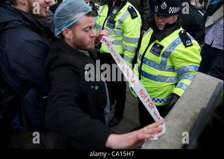 London, UK. 17/03/2012. UKUncut Protester call on the government to scrap its reforms of the NHS. ThUK uncutters of all ages take part in protest and civil disobedience, andcall on the government to scrap its reforms of the NHS, which they say are creating a market for healthcare and privatising the Stock Photo