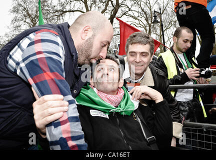 17/03/2012, London, UK: Paul Conroy, a Sunday Times photographer who was injured in Syria, makes an appearance at an Anti-Assad rally outside the Syrian Embassy in London and addresses the crowd. He spent most of the day in a wheelchair. Stock Photo