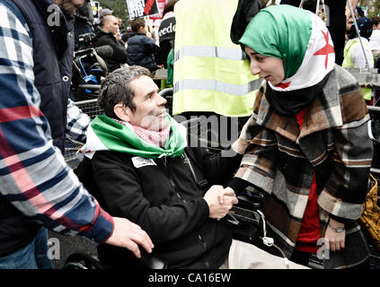 17/03/2012, London, UK: Paul Conroy, a Sunday Times photographer who was injured in Syria, makes an appearance at an Anti-Assad rally outside the Syrian Embassy in London and addresses the crowd. He spent most of the day in a wheelchair. Stock Photo