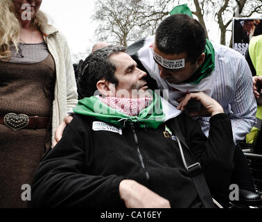 17/03/2012, London, UK: Paul Conroy, a Sunday Times photographer who was injured in Syria, makes an appearance at an Anti-Assad rally outside the Syrian Embassy in London and addresses the crowd. He spent most of the day in a wheelchair. Stock Photo