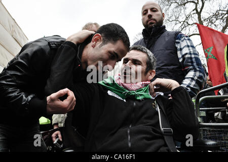 17/03/2012, London, UK: Paul Conroy, a Sunday Times photographer who was injured in Syria, makes an appearance at an Anti-Assad rally outside the Syrian Embassy in London and addresses the crowd. He spent most of the day in a wheelchair. Stock Photo