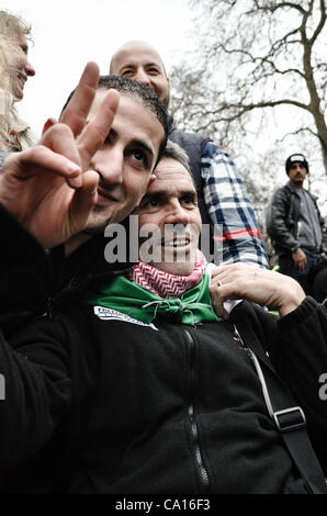 17/03/2012, London, UK: Paul Conroy, a Sunday Times photographer who was injured in Syria, makes an appearance at an Anti-Assad rally outside the Syrian Embassy in London and addresses the crowd. He spent most of the day in a wheelchair. Stock Photo