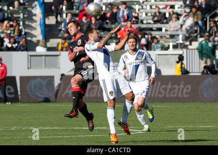 March 18, 2012 - Carson, California, U.S - Los Angeles Galaxy midfielder Juninho #19 and D.C. United midfielder Stephen King #20 fight for the ball during the Major League Soccer game between DC United and the Los Angeles Galaxy at the Home Depot Center. The Galaxy went on to defeat United with a fi Stock Photo