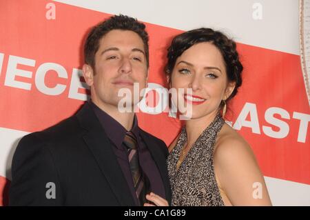 Jason Biggs, Jennifer Mollen at arrivals for AMERICAN REUNION Premiere, Grauman's Chinese Theatre, Los Angeles, CA March 19, 2012. Photo By: Dee Cercone/Everett Collection Stock Photo