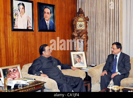 President, Asif Ali Zardari exchanges views with former Senate Chairman, Senator Farooq H Naek during farewell meeting - Stock Photo