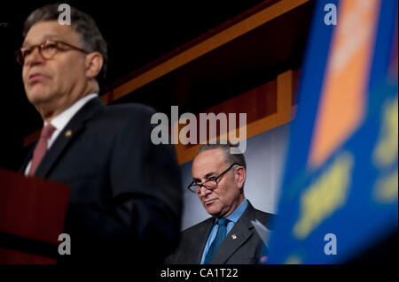 March 21, 2012 - Washington, District of Columbia, U.S. - Senate Rules and Administration Chairman CHUCK SCHUMER (D-NY) looks on as Senator AL FRANKEN (D-MN) speaks at a press conference to announce new legislation ''to blunt the worst effects'' of the Supreme Court's Citizens United v. Federal Elec Stock Photo