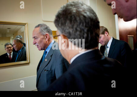 March 21, 2012 - Washington, District of Columbia, U.S. - Senate Rules and Administration Chairman CHUCK SCHUMER (D-NY) confers with Senator AL FRANKEN (D-MN) following a news conference on Capitol Hill Wednesday to announce new legislation ''to blunt the worst effects'' of the Supreme Court's Citiz Stock Photo