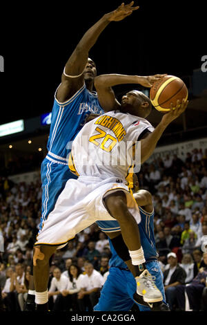 London Ontario, Canada - March 25, 2012. Eddie Smith (20) of the London Lightning is fouled by Tyrone Levett of the Halifax Rainmen.  The London Lightning defeated the Halifax Rainmen 116-92 in the fifth and deciding game to win the National Basketball League of Canada's championship. London player  Stock Photo