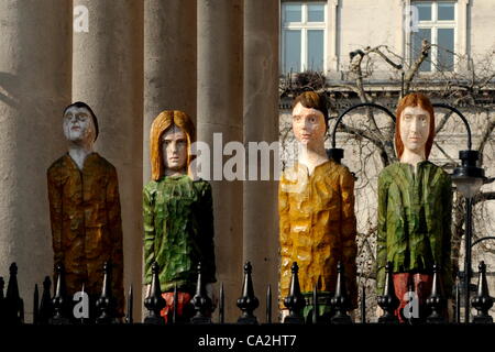 London, UK. 26/03/12. Four of the 39 wooden figures that make up the art installation Odyssey by Robert Koenig at the church, St Martin in The Fields overlooking Trafalgar Square. Stock Photo