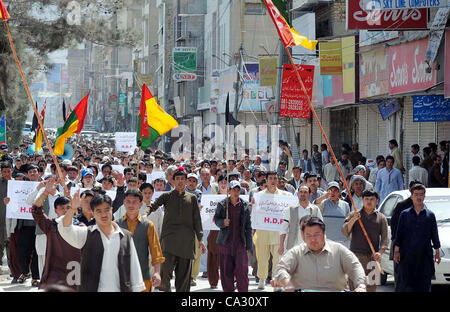 Supporters of Hazara Democratic Party (HDP) are protesting against target-killing of Hazara community during rally in Quetta on Thursday, March 29, 2012. Atleast six people including a woman were killed in terrorists attack on Thursday, a vehicle was on its way to the city Stock Photo