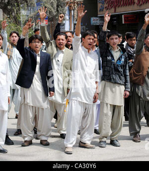 Supporters of Hazara Democratic Party (HDP) are protesting against target-killing of Hazara community during rally in Quetta on Thursday, March 29, 2012. Atleast six people including a woman were killed in terrorists attack on Thursday, a vehicle was on its way to the city Stock Photo