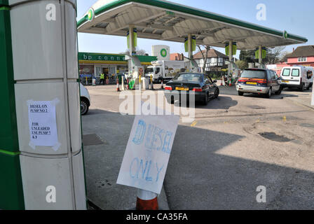 Southgate, London. 30/3/12 Garage attendant directs cars away from empty petrol pumps to the single pump of Diesel available at a BP petrol station in Southgate, London. Panic buying is due to the threat of Fuel tanker drivers striking. Stock Photo