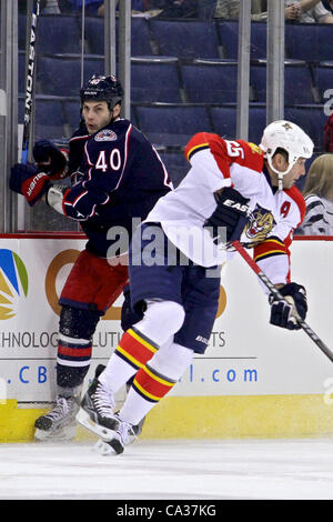 March 30, 2012 - Columbus, Ohio, U.S - Columbus Blue Jackets right wing Jared Boll (40) is checked into the boards by Florida Panthers defenseman Ed Jovanovski (55) in the first period of the game between the Florida Panthers and Columbus Blue Jackets at Nationwide Arena, Columbus, Ohio. (Credit Ima Stock Photo