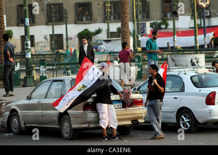 May 31, 2012 - Cairo, Cairo, Egypt - Egyptian Protester waves flag during a protest against candidate Ahmed Shafiq, at Tahrir Square in Cairo May 31, 2012. The prospect of Shafiq succeeding Hosni Mubarak as president of Egypt is a nightmare for revolutionaries and Islamists, but a security blanket f Stock Photo