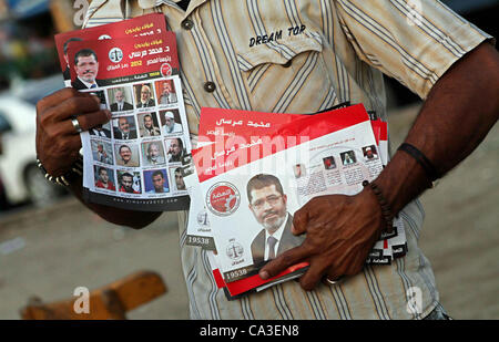 May 31, 2012 - Cairo, Cairo, Egypt - Egyptian Protester holds picture of candidate Mohammed Morsi during a protest against candidate Ahmed Shafiq, at Tahrir Square in Cairo May 31, 2012. The prospect of Shafiq succeeding Hosni Mubarak as president of Egypt is a nightmare for revolutionaries and Isla Stock Photo