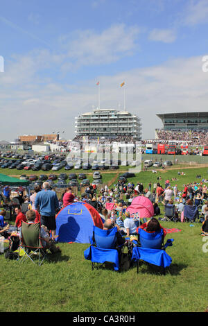02/06/12. Epsom Downs, Surrey, UK. Record crowds enjoy a day at the races in front of the Queen's Stand on Derby Day 2012. Stock Photo