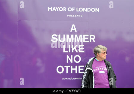 3rd June 2012. Southbank, London, UK. A 'London Ambassador' waits while the crowd enjoy the Pageant on the Thames. Stock Photo