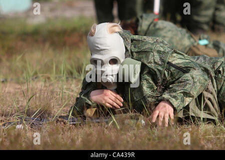 May 29, 2012 - Leningrad region, Russia - May 29,2012.Leningrad region of Russia. Pictured: 'Survival Course' for women serving in Russian Army as contract soldiers held in Russian Armed Forces Western Military District Training Centre...Women soldier wearing gas mask during combat training. (Credit Stock Photo