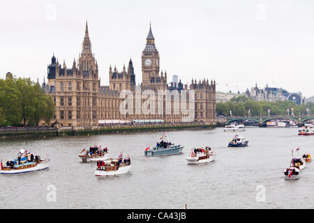The Royal river pageant on Sunday 3rd June 2011. Celebrating the Queens diamond Jubilee on the river Thames London, England, The Dunkirk little ships pass the houses of parliament. Stock Photo