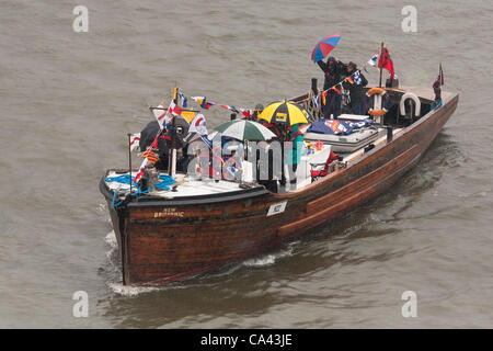 The New Britannic, a Dunkirk Little Ship proceeds along River Thames, as part of the Queen’s Thames Diamond Jubilee Pageant, taken from Tower Bridge, London, UK, 3rd June 2012. The Diamond Jubilee celebrates Queen Elizabeth the second’s 60 years as Head of the Commonwealth. Stock Photo